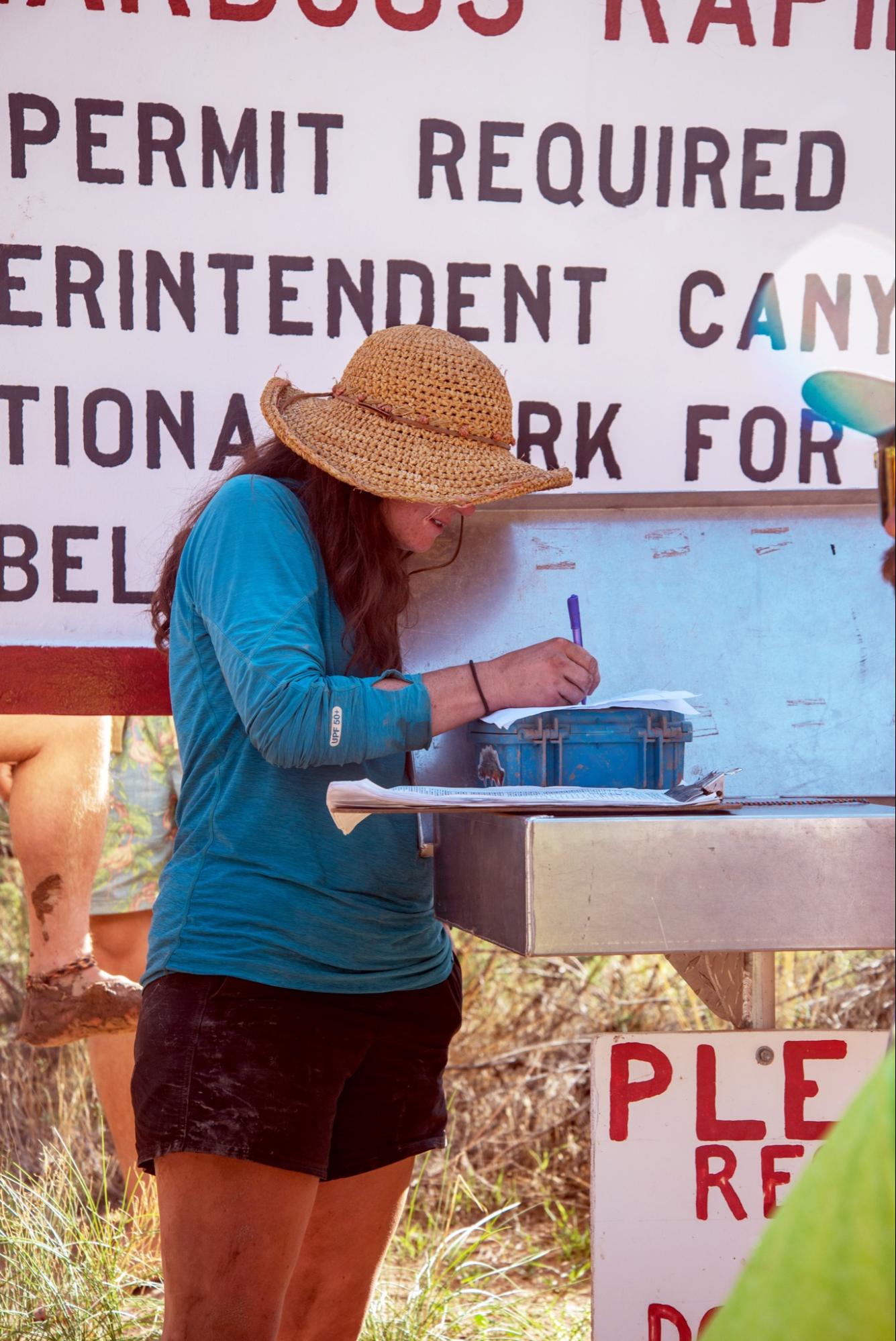 Women writing rafting permit